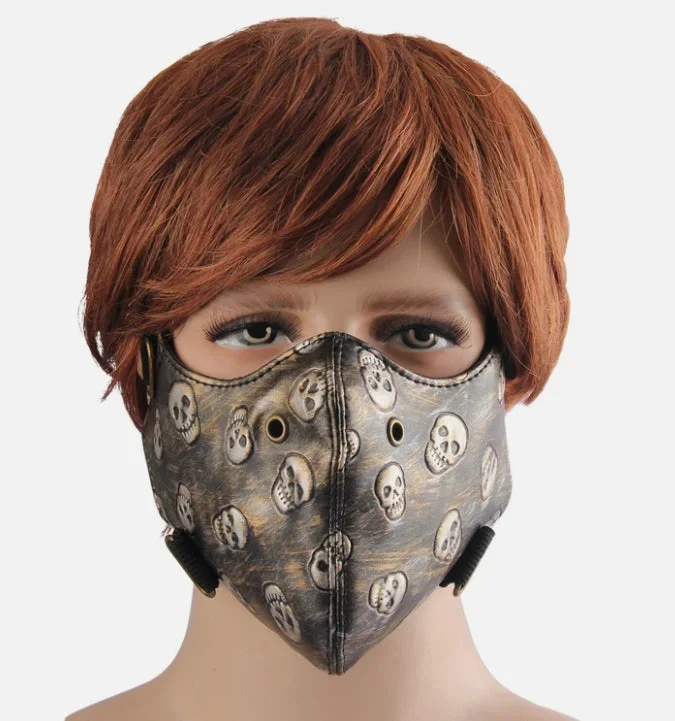 Ansiktsmask i konstläder med döskallemönster – bronsdetaljer - Bild 1