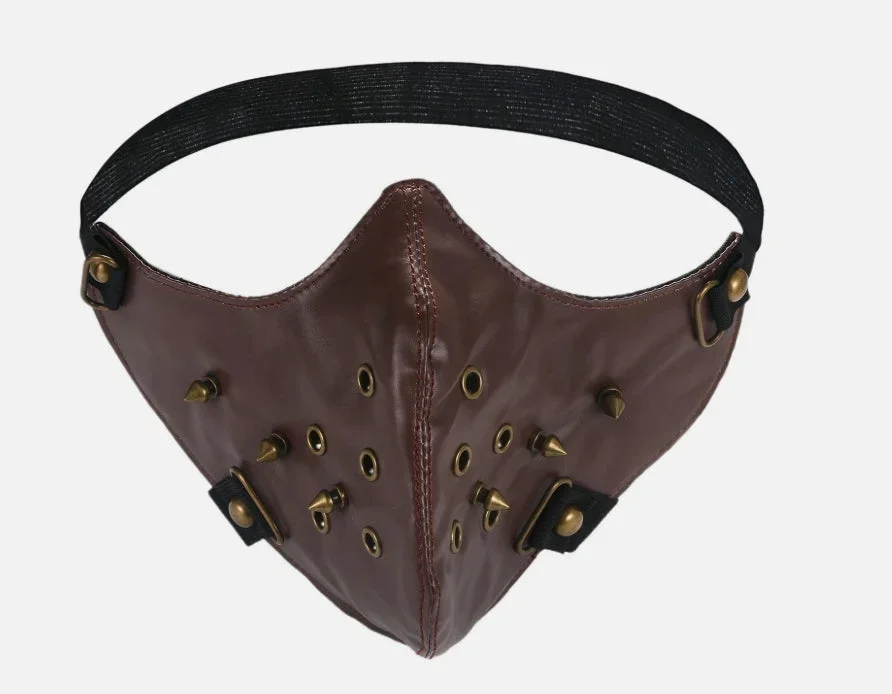 Mörkbrun ansiktsmask i konstläder med bronsnitar & öljetter - Bild 1